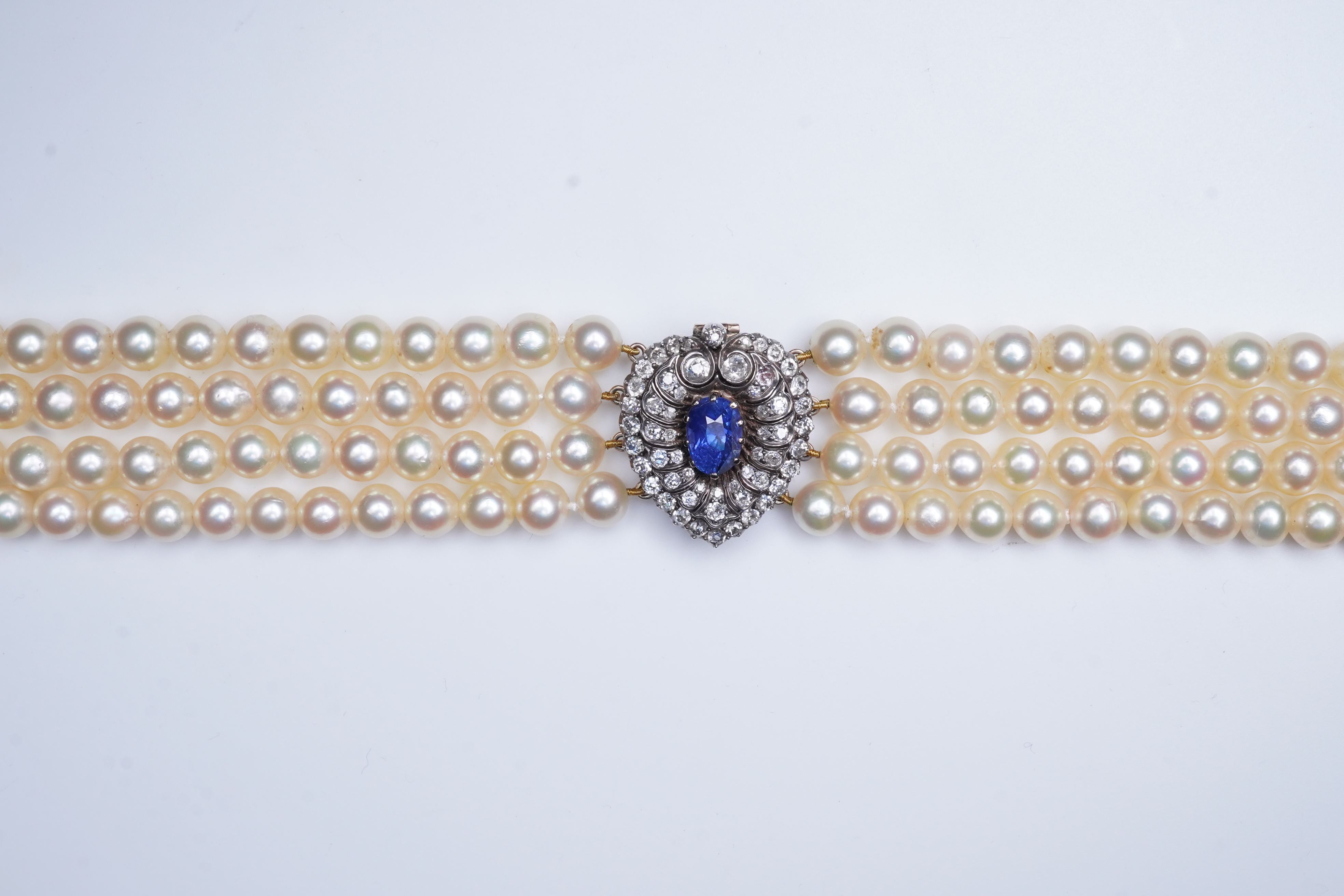 A late Victorian sapphire and diamond brooch and cultured pearl necklace, circa 1900 and later